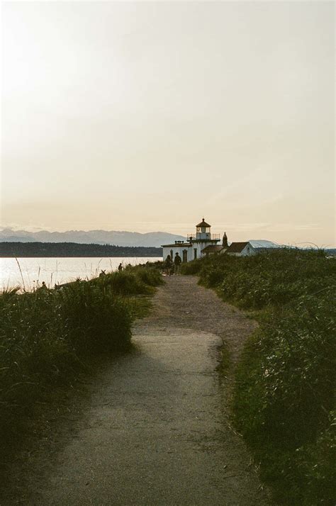 Download Discovery Park Lighthouse Path Seattle Wallpaper | Wallpapers.com