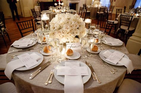 Champagne Table Linens With White Flowers And Candles