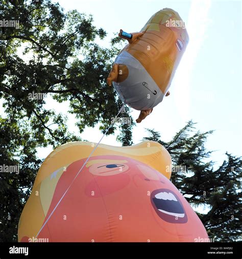 Members of the public view a Donald Trump baby balloon on display ...