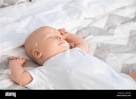 Cute Little Baby Sleeping On Bed At Home Stock Photo Alamy