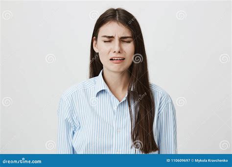 Sad And Disappointed Adult Woman Who Is About To Cry With Frowned