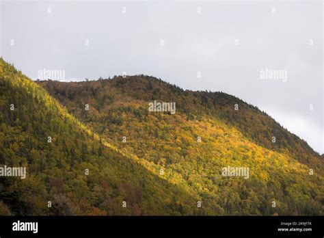 Cape Breton Nova Scotia Autumn Colors As Sun Rays Fall On Mountains