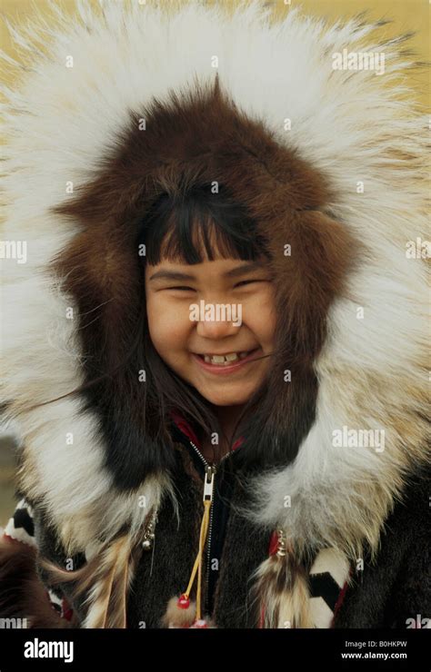 An Alaskan Inupiat Eskimo Girl Wearing A Caribou Skin Parka With Stock
