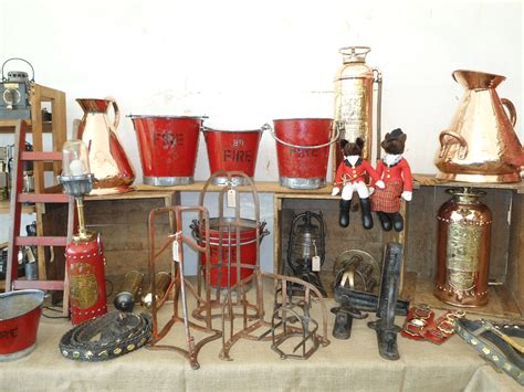 A Selection Of Fire Buckets And Copper Jugs From Arthur Swallow Fairs At