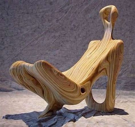 A Wooden Chair Made Out Of Wood Sitting On Top Of A Blue Cloth Covered