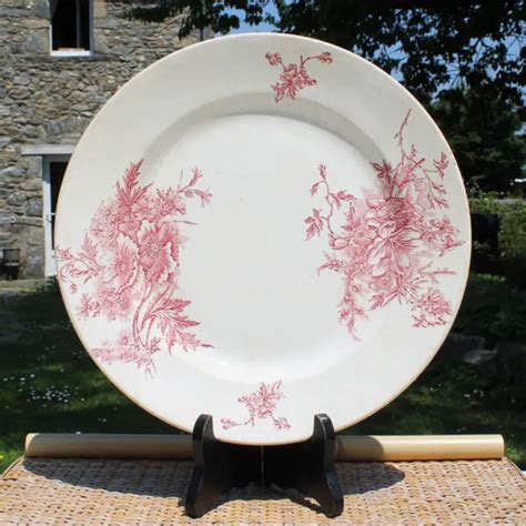 GRANDE ASSIETTE ANCIENNE Terre de fer en faïence décor fleurs roses ø