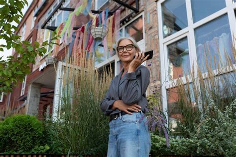 Premium Photo Charming Slim Mature Woman With Glasses Dressed In A