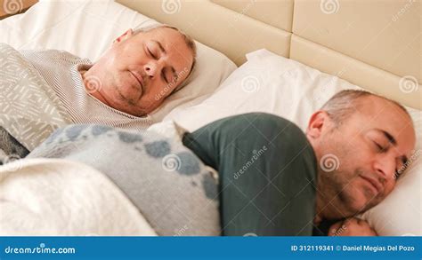 Mature Gay Couple Waking Up In Bed In The Morning Stock Image Image