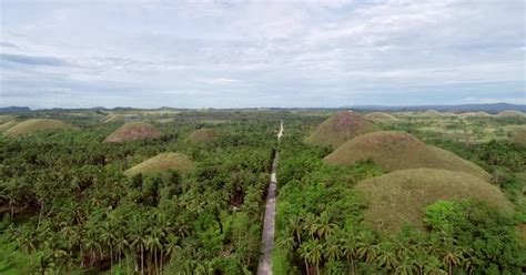 Aerial view road crossing the Chocolate Hills Complex, Batuan ...