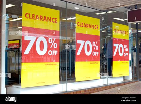 Clearance Sale Posters In Shop Window Stock Photo 25799591 Alamy