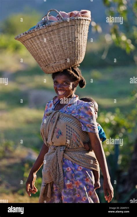 African Woman Carrying Basket On Head