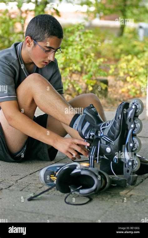 Dark hair boy inline skates hi-res stock photography and images - Alamy