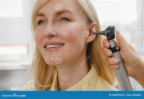 Patient Having Check Up Of Hearing At Doctor Otolaryngologist Stock