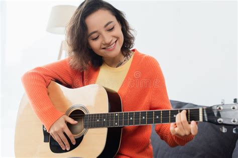 Happy Young Woman Playing Acoustic Guitar Stock Photo - Image of ...