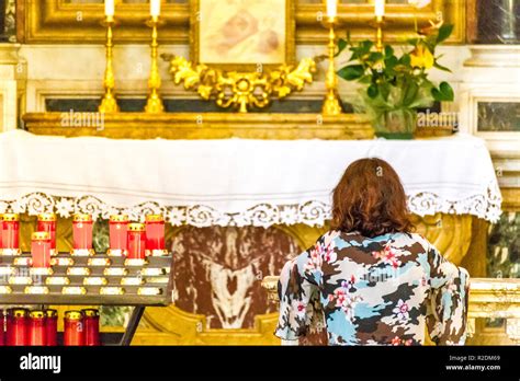 Kneeling In Prayer At Altar