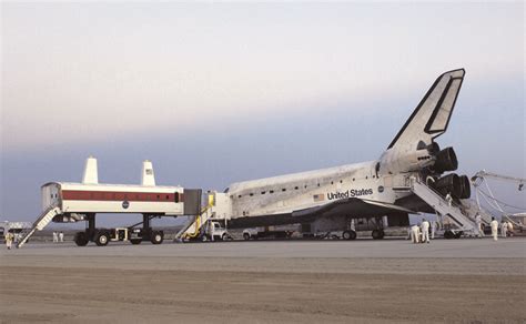 The Crew Transport Vehicle Approaches The Space Shuttle Discovery After