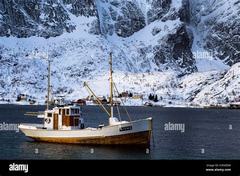 Norwegian Fishing Boat Sailing Through The Seas Of The Lofoten Islands