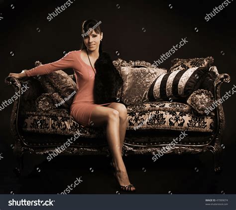 Beautiful Brunette Sitting On Sofa Stock Photo 47999074 Shutterstock