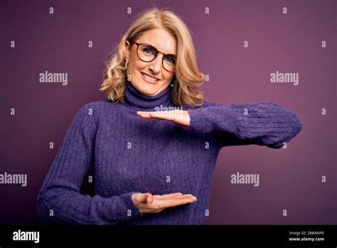 Middle Age Beautiful Blonde Woman Wearing Casual Purple Turtleneck Sweater And Glasses Gesturing