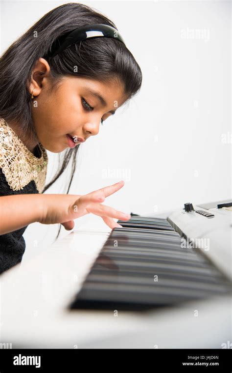 Indian Kids Playing Piano Or Keyboard A Musical Instrument Stock Photo