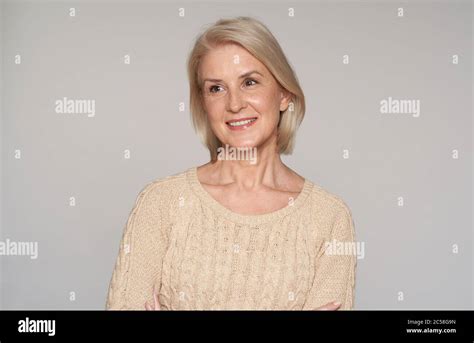 Portrait Of Beautiful Senior Woman Smiling 50 Years Old Blonde Lady