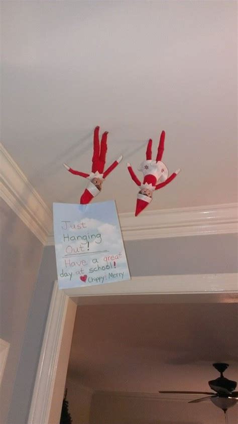 Two Elfs Are Hanging From The Ceiling