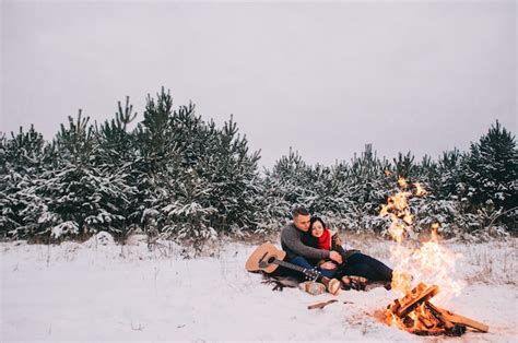 Premium Photo Couple In Love By A Campfire Winter