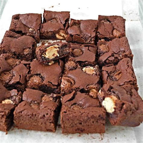 Chocolate Brownies Cut Into Squares With Peanut Butter In The Middle On