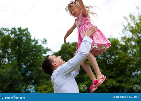 Father Is Playing With His Daughter On A Meadow Stock Image Image Of