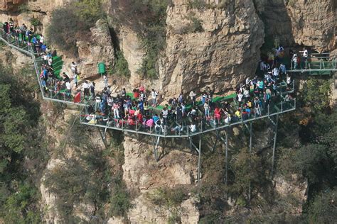 Glass walkway shatters above abyss, terrifying tourists