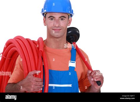 Plumber Holding Plunger And Length Of Flexible Pipe Stock Photo Alamy