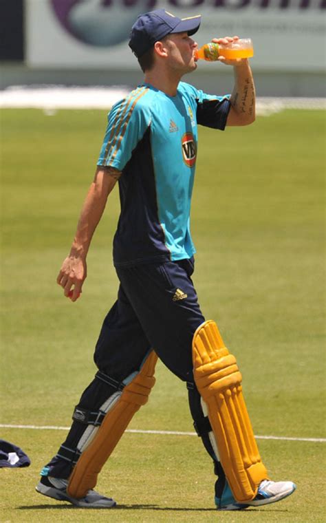 Michael Clarke Has A Drink During Training In The Nets At Dubai Sports