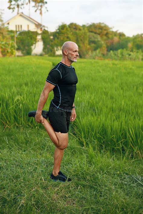 Mature Couple Running On Rice Field In Morning Caucasian Man And Asian