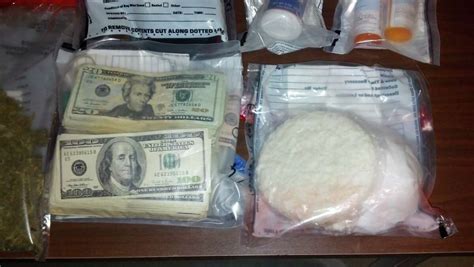 Police Raid Nets Drugs Cash