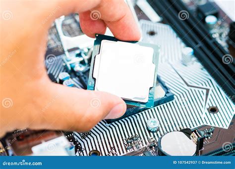 The Engineer Installing Central Processing Unit Cpu On Motherboard