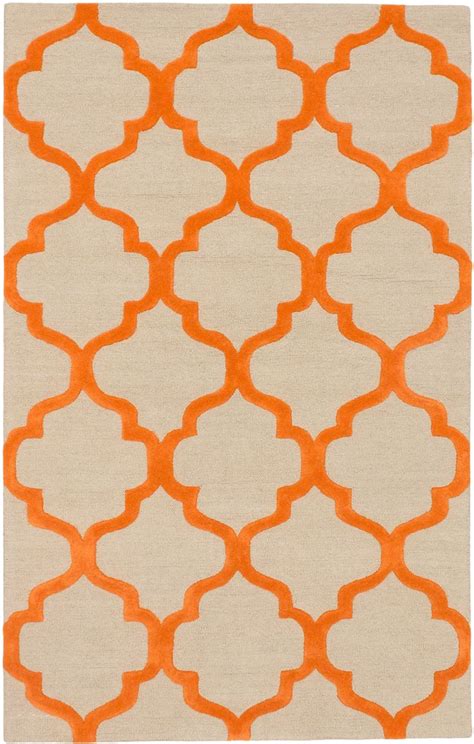 An Orange And White Rug With Geometric Shapes On It S Sides In The