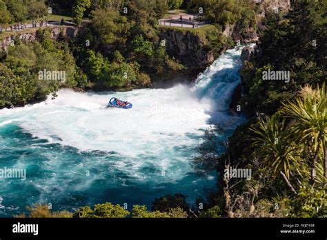 A jet boat with tourists races close to Huka Falls - most visited ...
