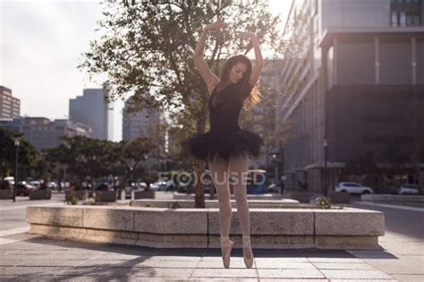 Graceful woman performing ballet in the city — people, talent - Stock ...