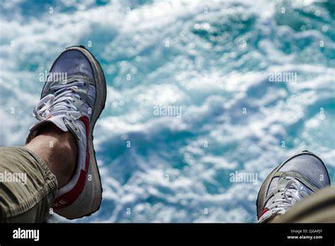 The Shoes With A Blurry Blue Water Background Stock Photo Alamy