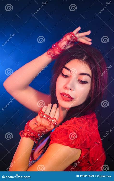 Tempting Traditional Oriental Belly Dancer Girl Dancing On Purple Neon