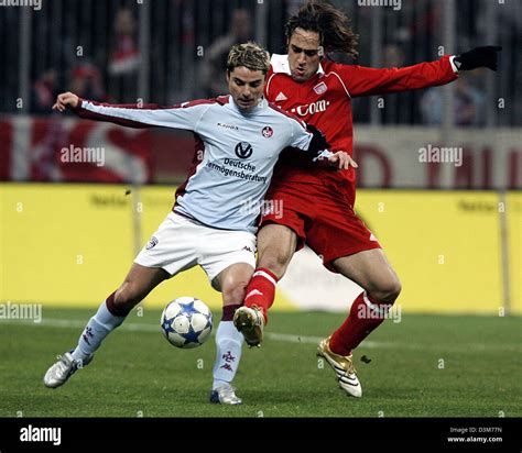 (dpa) - Munich's Ali Karimi (R) fights for the ball with Kaiserslautern ...