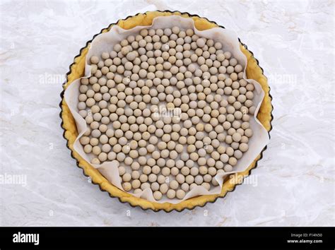 Ceramic Beans Used As Pastry Weights In An Uncooked Pie Crust Lined With Greaseproof Paper Stock