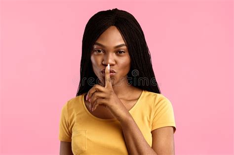 Black Lady Showing Finger Lips Posing Over Blue Background Stock Photos