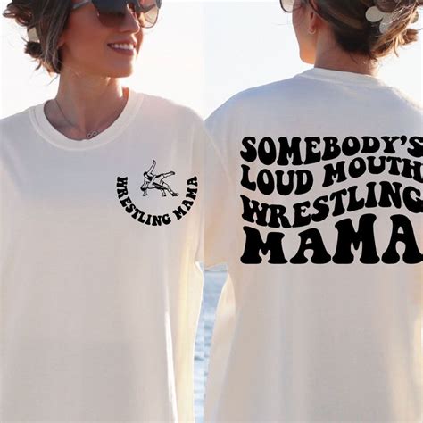 Two Women Wearing Matching Tshirts That Say Somebody S Loud Mouth