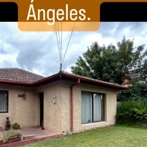 An Image Of A House With The Words Angels Above It In Spanish And