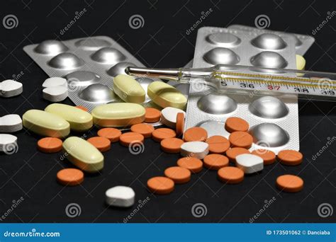 Medicine Pills with Fever Thermometer. Concept Image Stock Photo ...