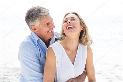 Happy couple laughing together — Stock Photo © Wavebreakmedia #73284495