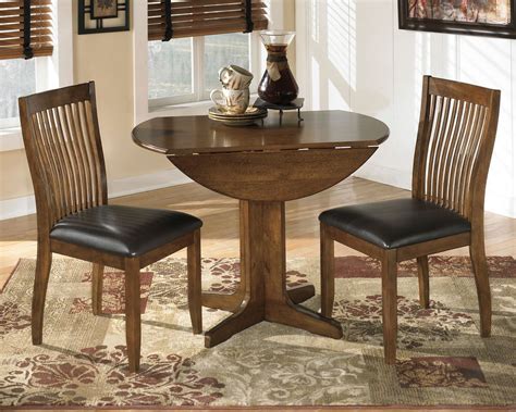 Stuman Medium Brown 3 Pc Round Drop Leaf Table 2 Upholstered