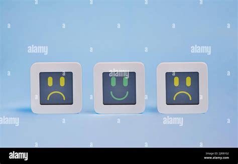 Set Of Computers With Stylized Faces Of Happy And Sad Faces On Lcd