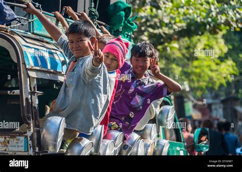 mandalay myanmar circa december  happy burmese children riding